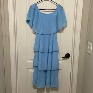 Blue dress. Can be worn off the shoulder also. Washed but never worn.
